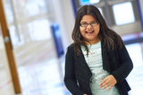 Young girl in hallway smiling Young girl in hallway smiling