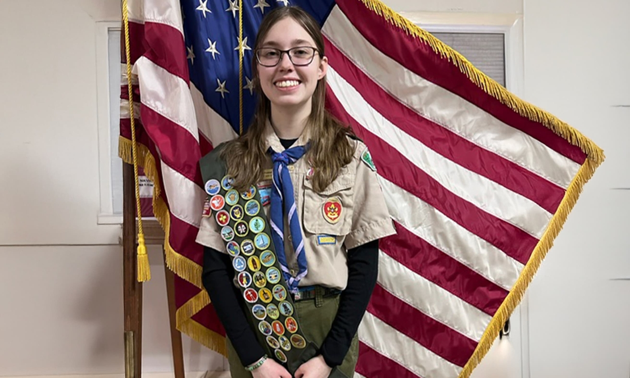 Alice with Eagle Scout badges