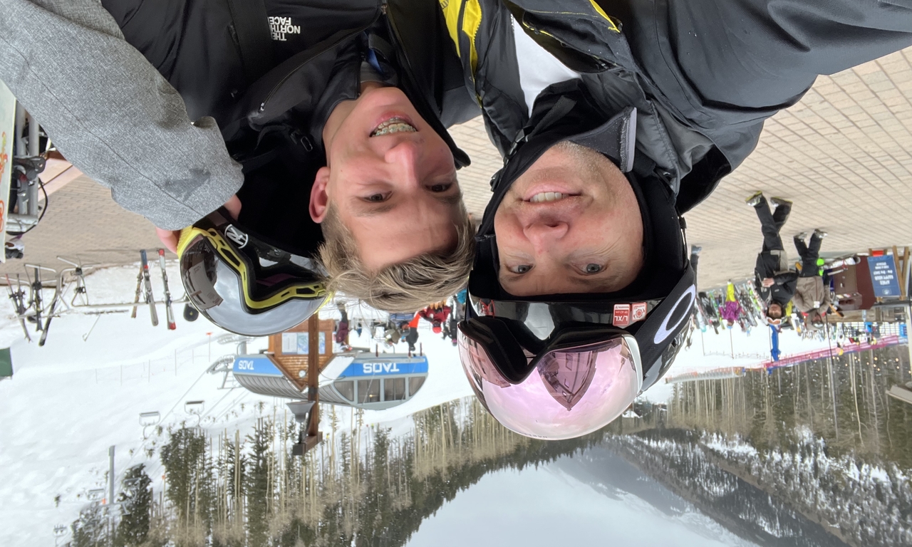 Xavier with his dad, Chris, skiing