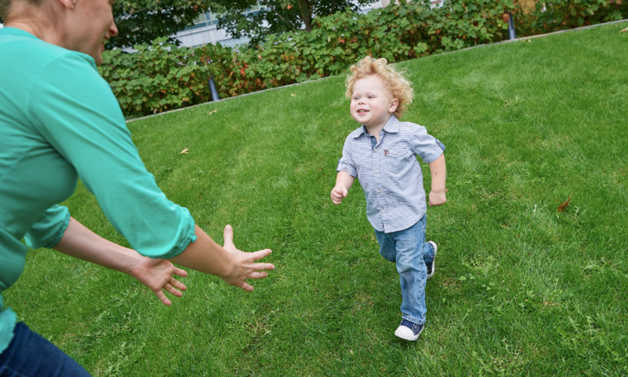 young boy IBD patient running to mom's arms