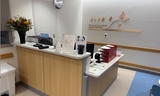 This image shows reception desk in waiting room.