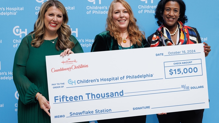 Samantha DiPoppo, SVP Programming and Annie Howell, Chief Communications Officer from Hallmark Media present check to CHOP's Chief Development Officer, Monica Taylor Lotty.