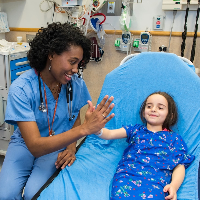 Doctor giving a high-five to a patient