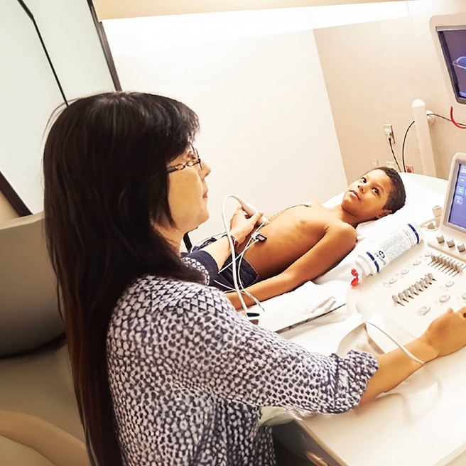 male patient receiving being tested wtih ultrasound