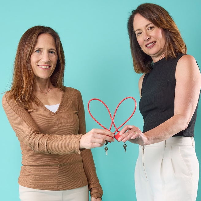 Dorothy Novick, MD, and Kimberly Sterner-Stein, MSW, MPH, display gun locks that are distributed free to families.