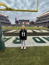 child standing on football field