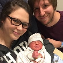 Austin as infant, with parents