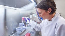 researcher with pipette