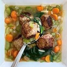 Bowl of meatball and veggie soup