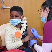 Young boy receiving vaccination