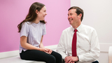 Emma, now 12, at a check-up with Dr. Flynn to monitor her spinal curve.