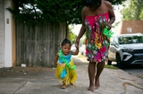 Klaire walking with her mother