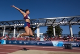 CHOP patient and Paralympian Annie flies through the air in the long jump.
