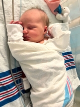 The infant is sleeping.