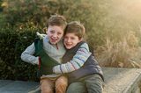 Liam and his brother are happy.