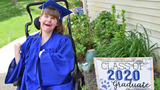 Cate smiling in her graduation gown