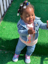 baby girl standing outside