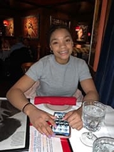 Zoe smiling at the table