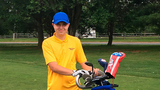 Jacob with his golf clubs