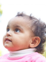 little girl looking up smiling