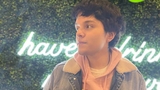 Kevin standing in front of leaf background