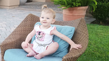 April sitting on a chair