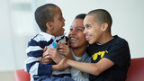 Mom with 2 sons smiling Mom with 2 sons smiling