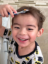 Elias pretending to shave