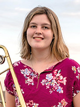 Maddie holding her instrument
