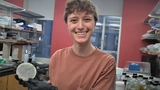Emma in her lab at school