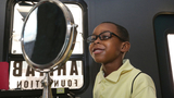 Child chooses glasses after eye exam
