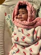 Levi snuggled up in her blanket