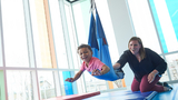 Cruz smiling in therapy swing