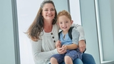 boy patient and mom smiling at camera