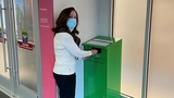 Woman using the drug give back box