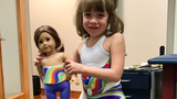 patient with doll wearing brace