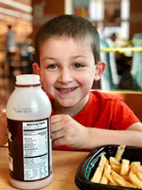 Will, now in first grade, eating lunch