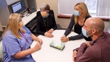 Members of CFDT team speaking with patient family