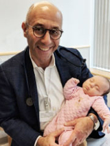 Dr. Rychik holding Amelia