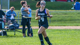 GI patient playing lacrosse on field