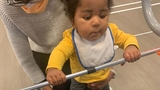 Hassani walking with assistance