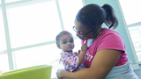 Mother holding young daughter Mother holding young daughter
