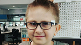 Riley trying on glasses