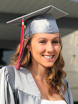 Emma in her graduation gown and cap