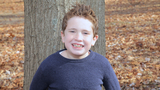 Jacob smiling outside