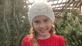 Katie Grace standing in front of trees