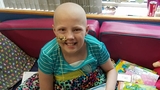 Lexi in her hospital room