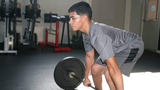 Luis at the gym lifting weights