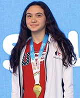 Maia wearing a gold medal