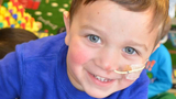 Matthew crohns disease patient smiling in playroom